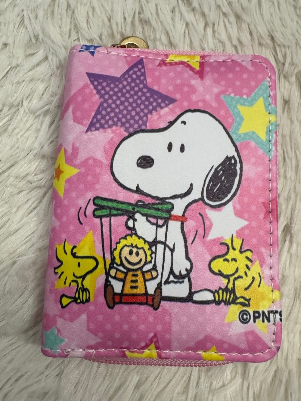 Snoopy and friends pink wallet Snoopy holding a marionette yellow stars